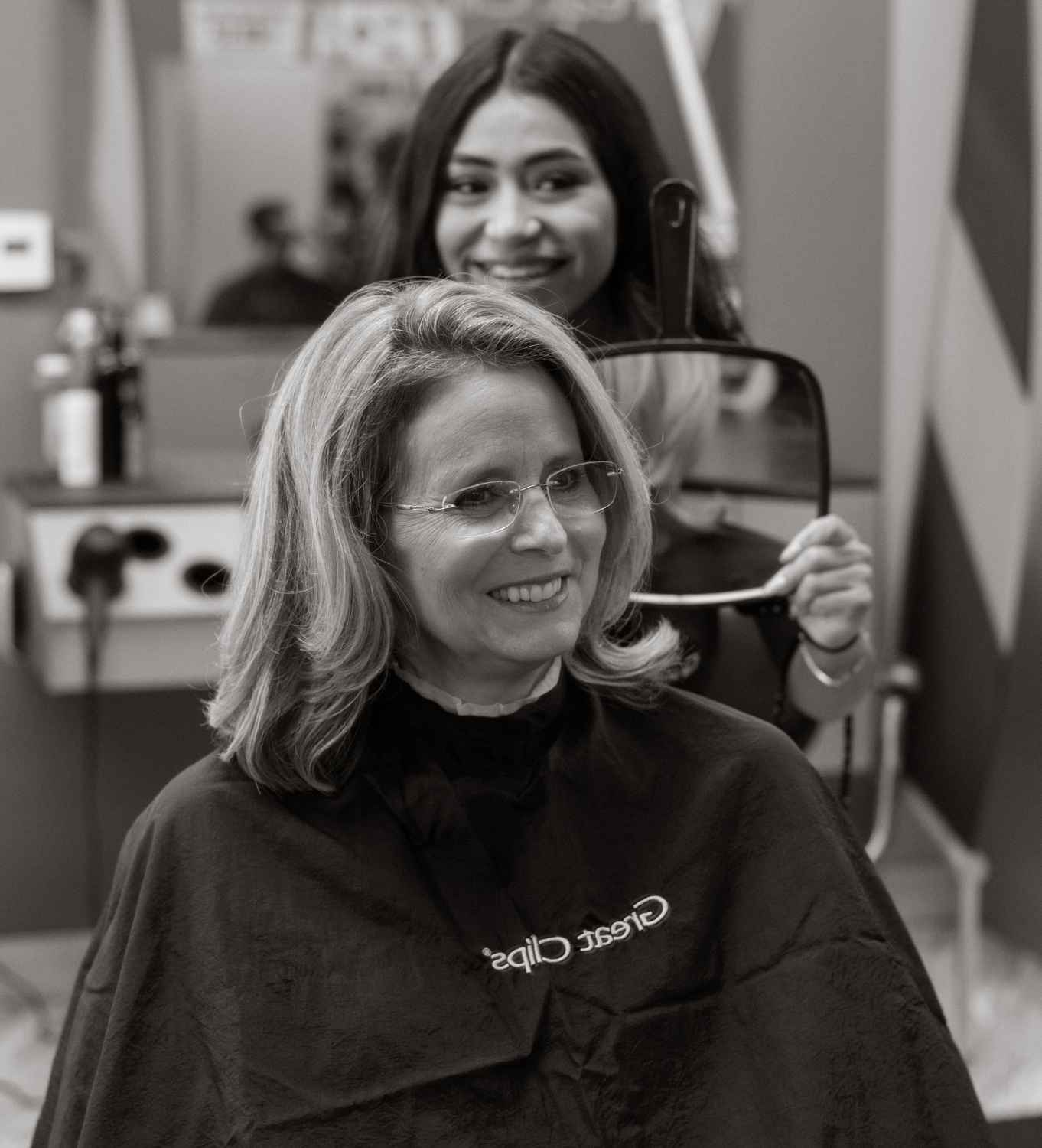 Stylist finishing a haircut